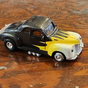 Vintage Black and Yellow Die-Cast Toy Car
